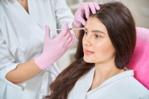 Patient is getting brow lifting with beauty shot