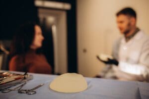 Breast implant consultation at Stanwix Plastic Surgery in Richmond discussing en bloc vs total capsulectomy