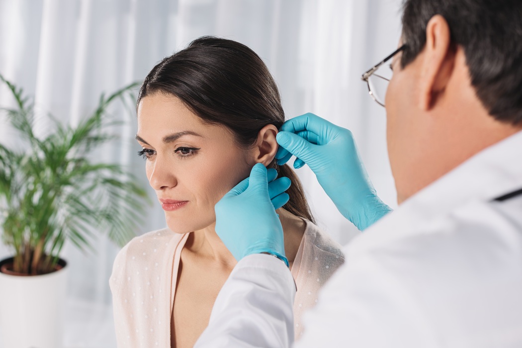 Close-up of earlobe damage examination performed by the team at Stanwix Plastic Surgery in Richmond, Virginia